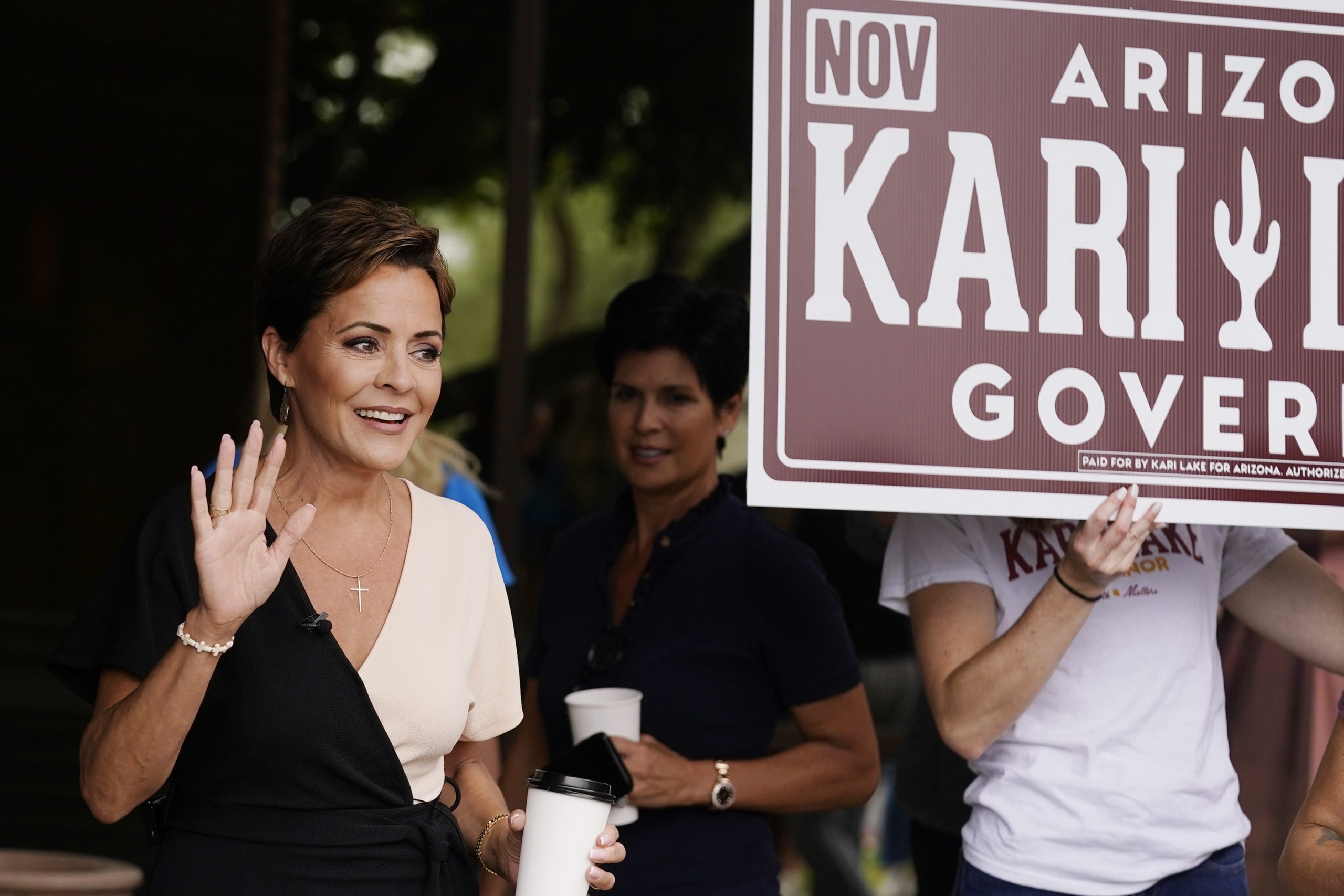 Kari Lake, Republican candidate for Arizona governor, waves to supporters before speaking at a news conference this week in Phoenix.