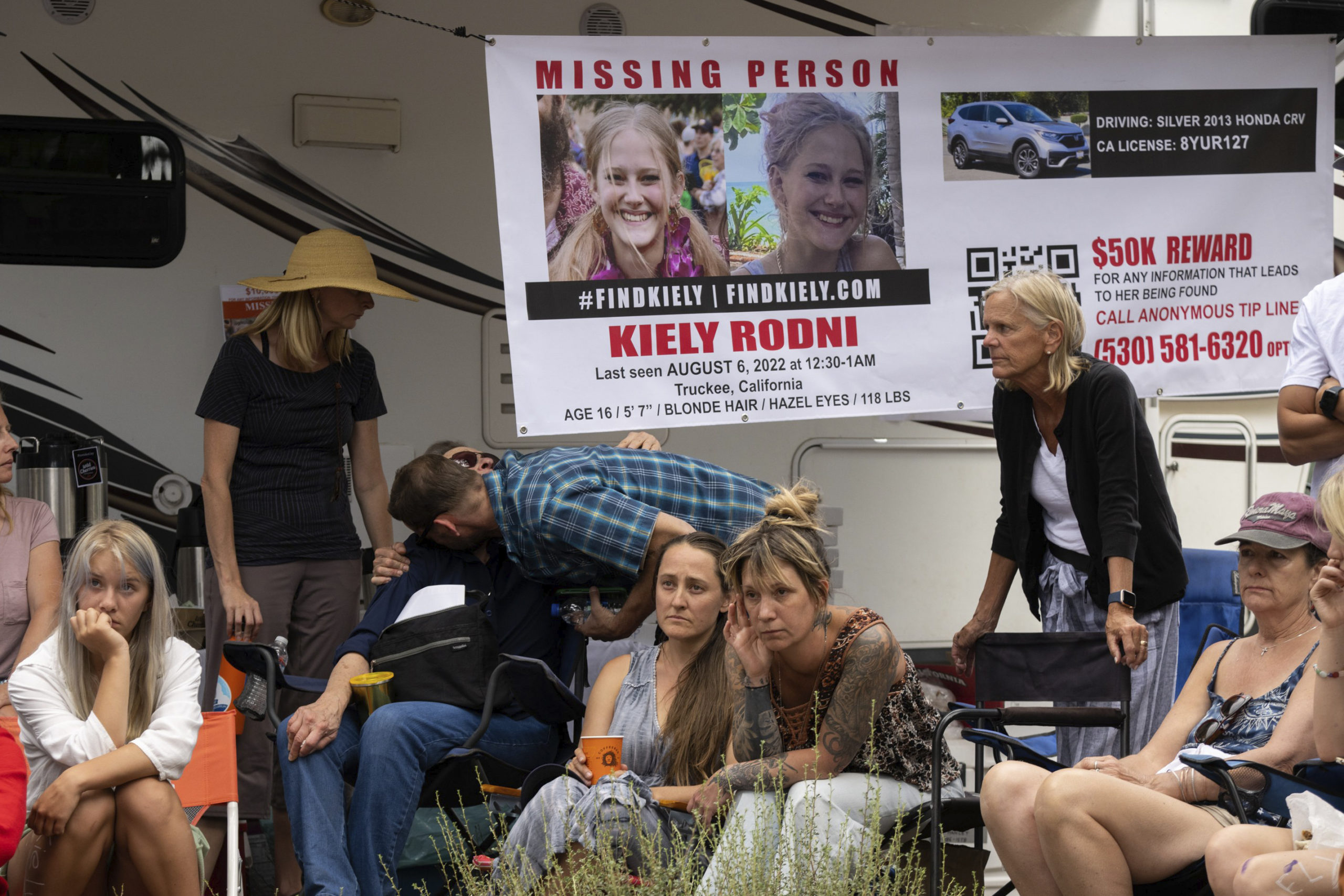 On Aug. 9, law enforcement officials give a news conference on missing 16-year-old Kiely Rodni, while her mother Lindsey Rodni-Nieman, center, listens.