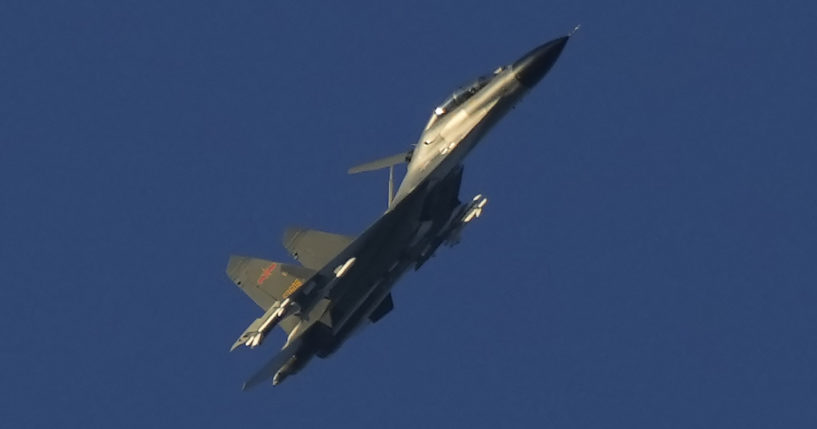 A Chinese J-11 military fighter jet flies on Friday above the Taiwan Strait near Pingtan, the closest land of mainland China to the island of Taiwan.