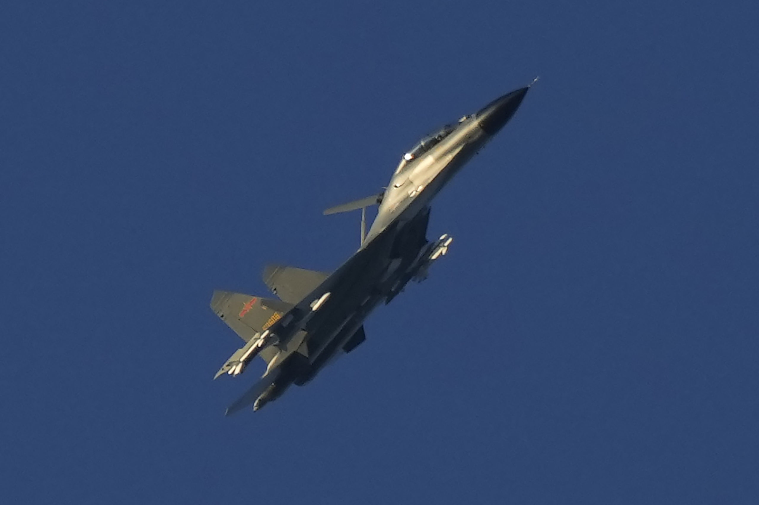 A Chinese J-11 military fighter jet flies on Friday above the Taiwan Strait near Pingtan, the closest land of mainland China to the island of Taiwan.