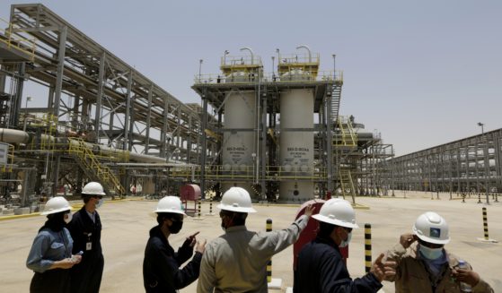 Saudi Arabian Aramco engineers and journalists look at the Hawiyah Natural Gas Liquids Recovery Plant in Hawiyah, Saudi Arabia, on June 28, 2021.