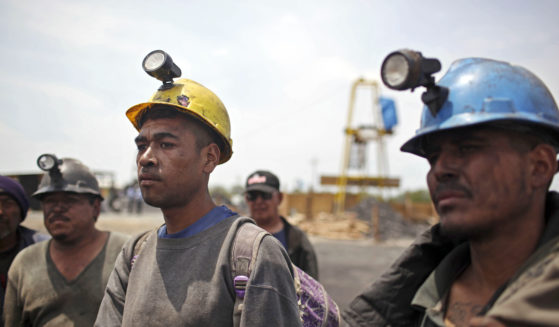 Miners helping in the rescue operation of fellow trapped miners are interviewed in San Juan de Sabinas, Coahuila state, in a May 2011 file photo.