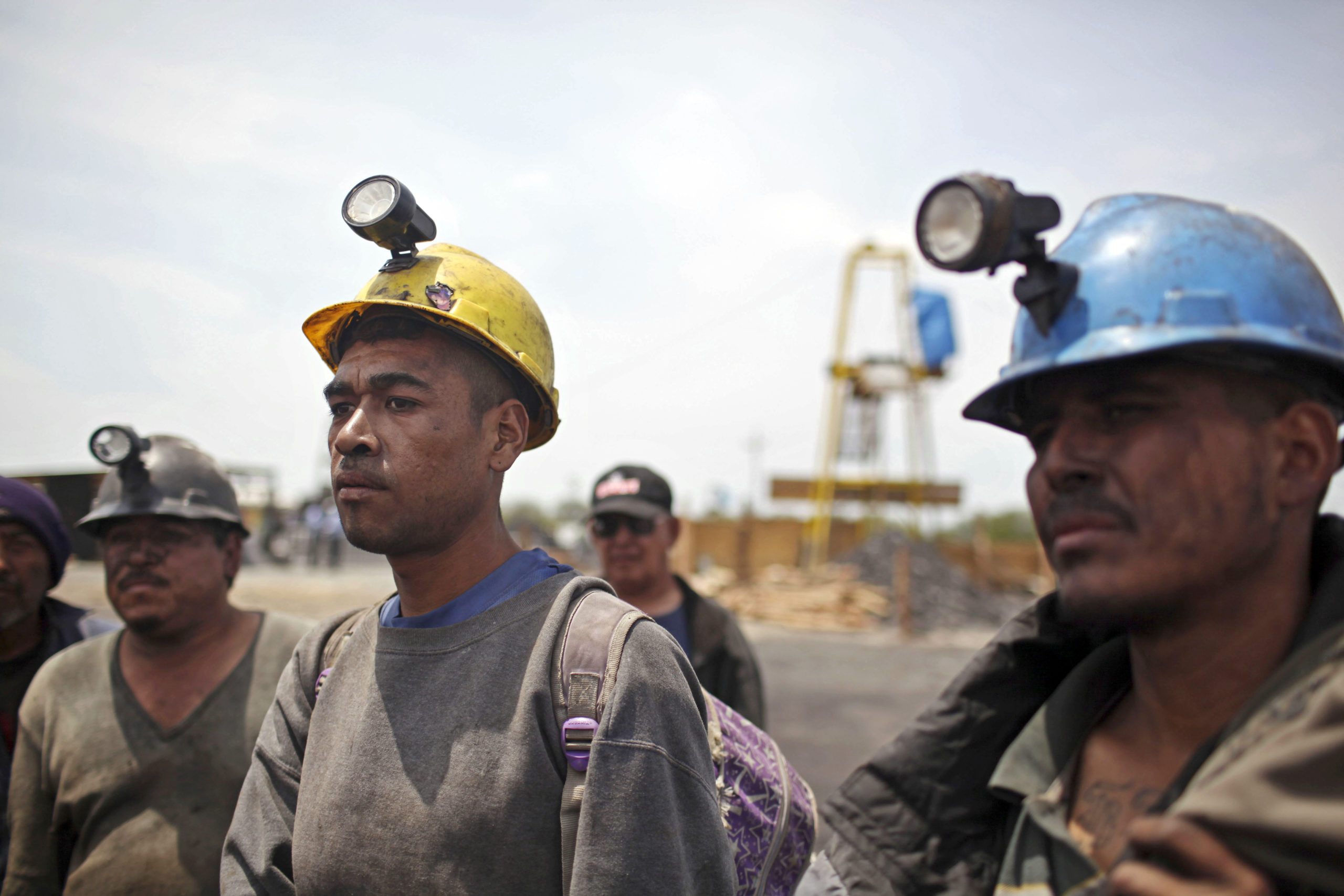 Miners helping in the rescue operation of fellow trapped miners are interviewed in San Juan de Sabinas, Coahuila state, in a May 2011 file photo.