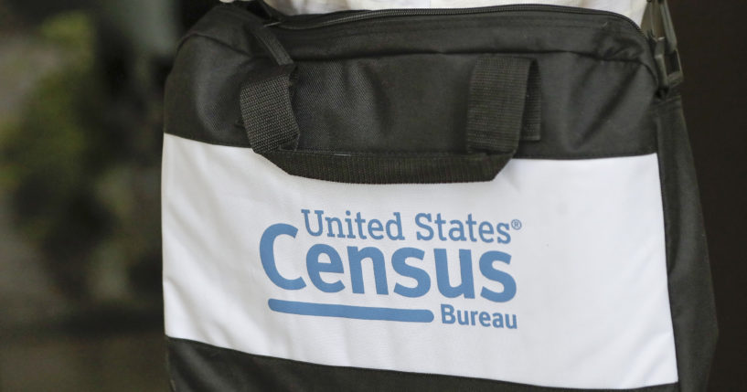 The bag of a U.S. Census Bureau census taker is pictured as he walks to a residence in Winter Park, Florida, on Aug. 11, 2020.