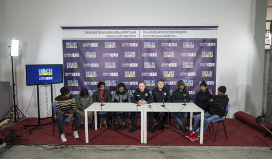 Sri-lankan former captives Nilojan Vasanthakumar, Uthayakamar Mary Edid Prema, Sharujan Gianeswaran, Thinees Jokenthhiran, Dilukshan Robertclive, Dilujan Paththinajakan, Ainkaranathan Ganesamoorthi and Head of investigation police department attend a news conference in Kharkiv, Ukraine, on Saturday.