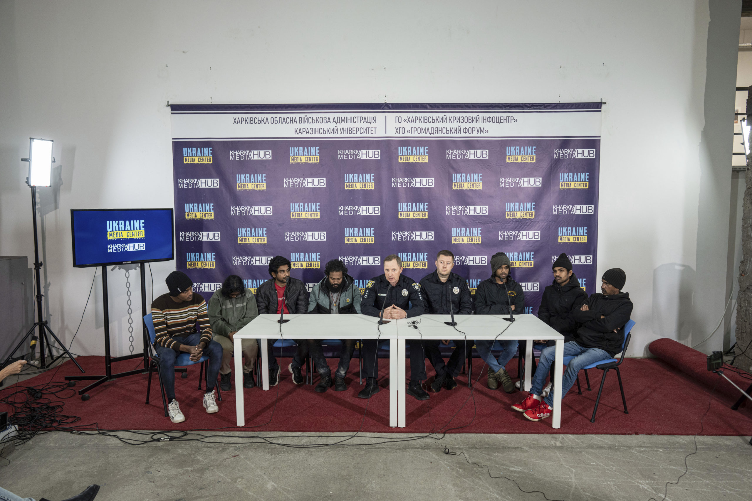 Sri-lankan former captives Nilojan Vasanthakumar, Uthayakamar Mary Edid Prema, Sharujan Gianeswaran, Thinees Jokenthhiran, Dilukshan Robertclive, Dilujan Paththinajakan, Ainkaranathan Ganesamoorthi and Head of investigation police department attend a news conference in Kharkiv, Ukraine, on Saturday.