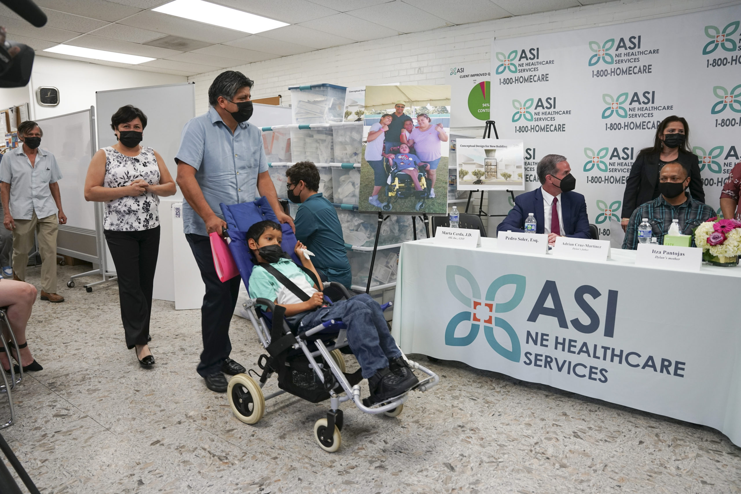 In this photo provided by Clifford Law Offices, Karina Aguilar, her husband, Temo, and their son Felipe attend a news conference on Aug. 3, 2021, at the office of ASI/NE Healthcare Services in Chicago.