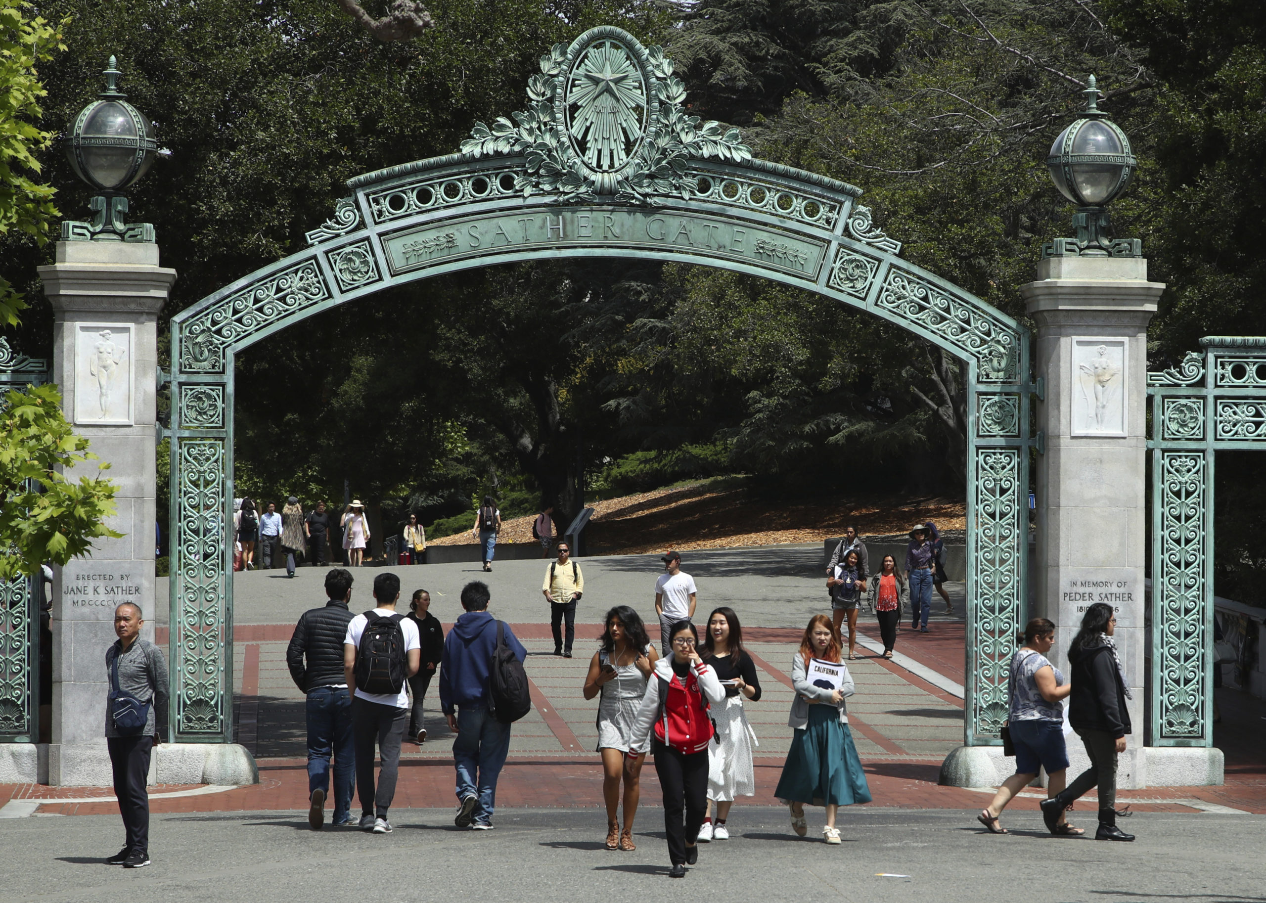 Students at the University of California at Berkeley in Berkeley, California, walk through the Sather Gate on May 10, 2018.