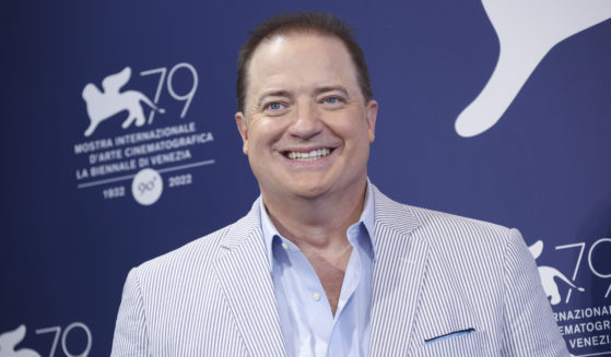 Brendan Fraser takes photos during the photo call for "The Whale," his new film debuting at the 79th edition of the Venice Film Festival in Venice, Italy on Sunday.