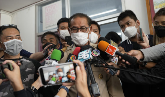 Chief executive of Uthai Sawan Sub-district Administrative Organization Danaichok Boonsom talks to reporters at a police station in Uthai Sawan, north eastern Thailand, on Sunday.