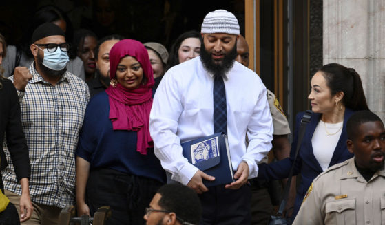 Adnan Syed, center right, leaves the courthouse after a hearing on Sept. 19, 2022, in Baltimore, Maryland.