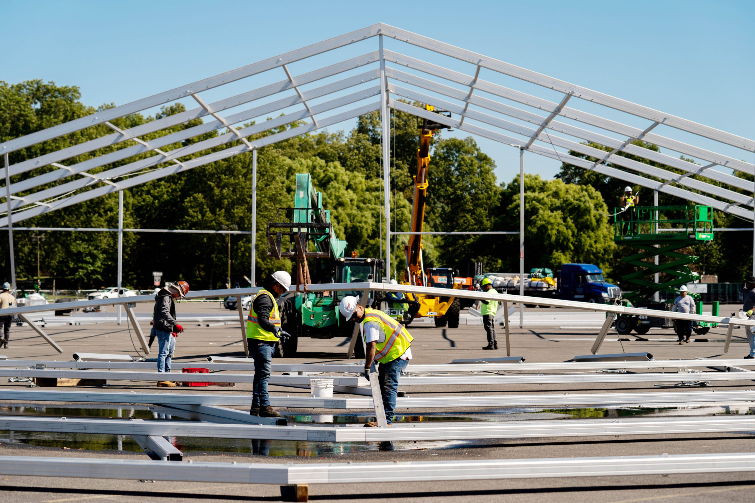 Workers build a hanger-sized tent as a temporary shelter for illegal immigrants in the Bronx, New York, on Sept. 27.