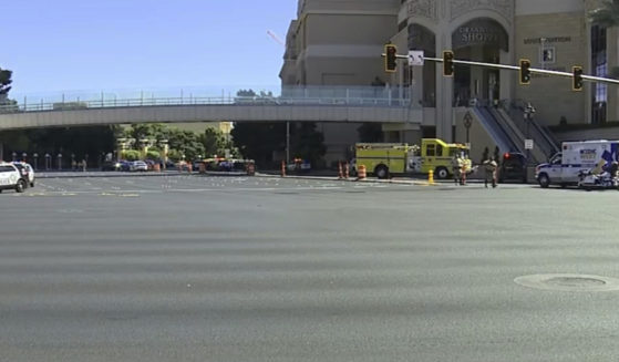 Emergency personnel respond to the scene of a stabbing on the Las Vegas trip on Thursday.