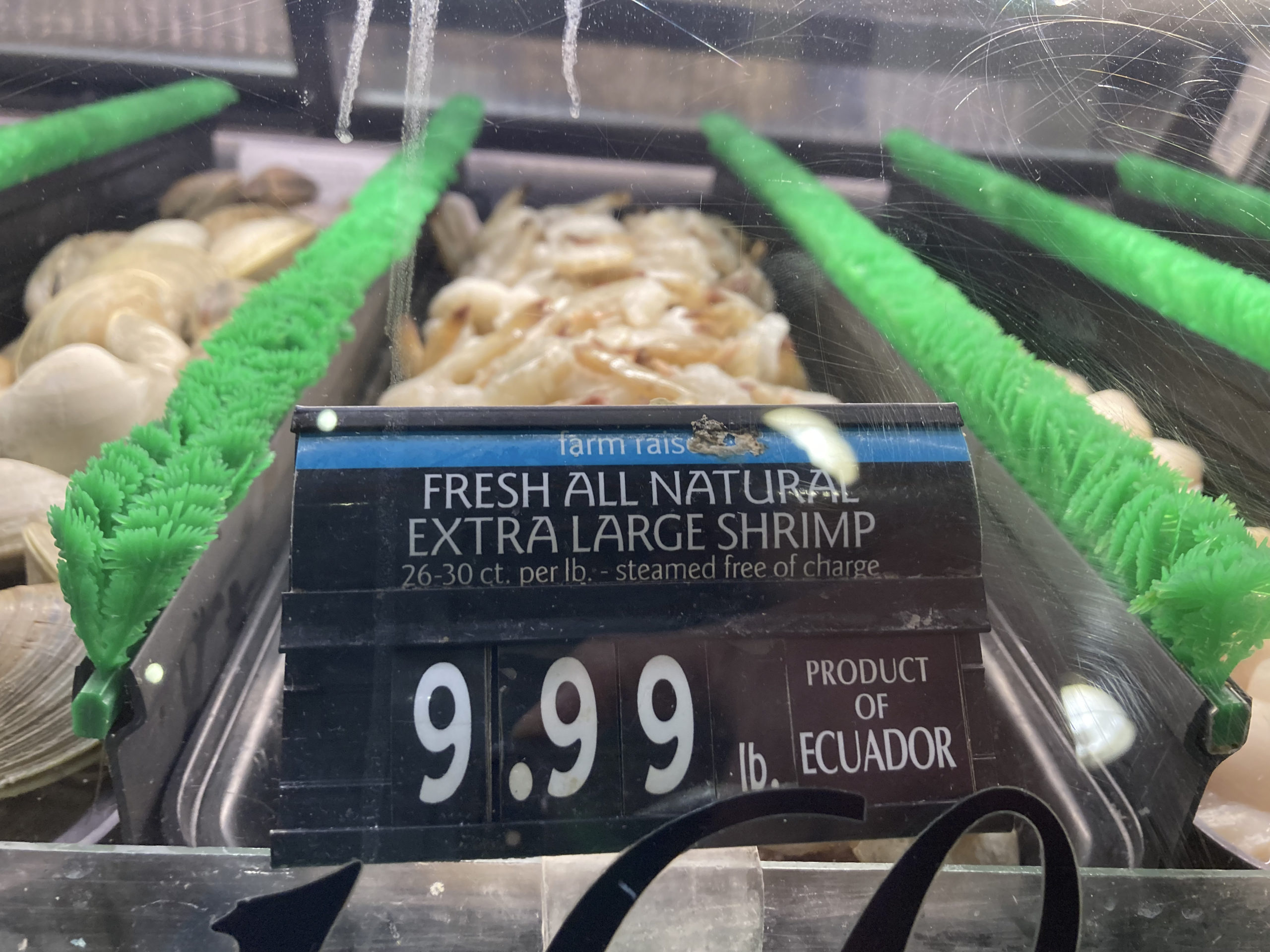 The price of shrimp is displayed at a market in Philadelphia in this file photo from June.