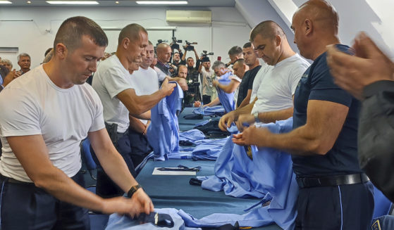 Serb police officers took off their uniforms after a a mass resignation in the town of Zvecan, Kosovo, on Saturday.