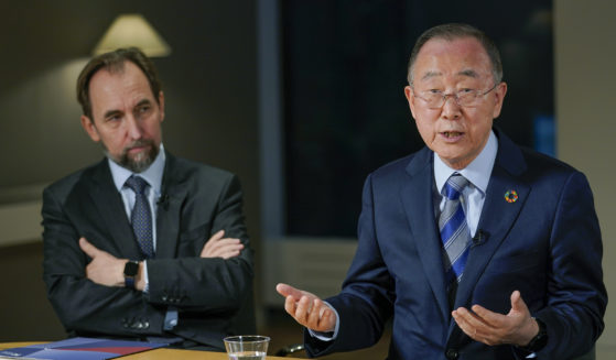 Former United Nations Secretary-General Ban Ki-moon, right, is joined by Zeid Raad Al Hussein, left, as he speaks during an interview with The Associated Press in New York City on Friday.