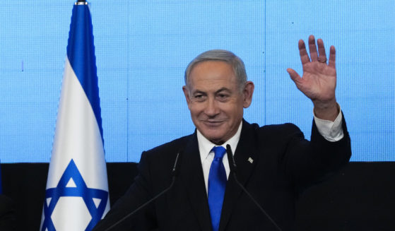 Benjamin Netanyahu, former Israeli Prime Minister and the head of Likud party, waves to his supporters after first exit poll results for the Israeli Parliamentary election at his party's headquarters in Jerusalem on Nov. 2.