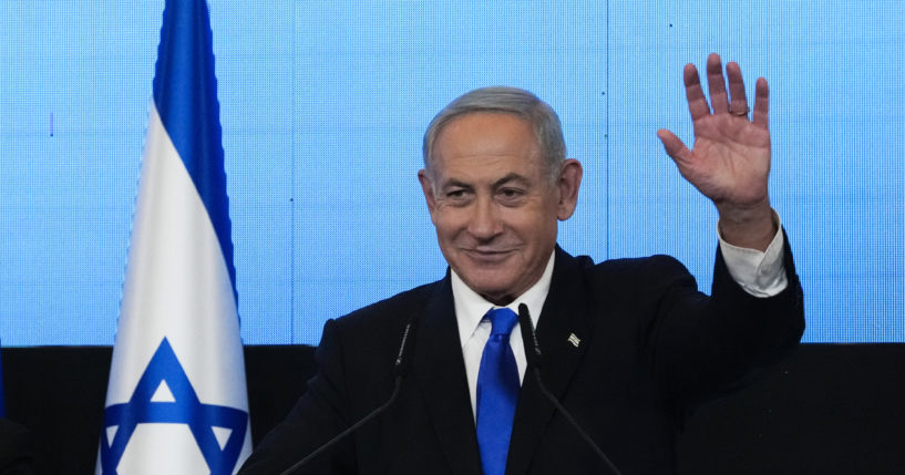 Benjamin Netanyahu, former Israeli Prime Minister and the head of Likud party, waves to his supporters after first exit poll results for the Israeli Parliamentary election at his party's headquarters in Jerusalem on Nov. 2.