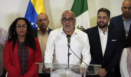 Jorge Rodriguez, center, speaks as part of the Venezuelan government delegation in Benito Juarez International Airport in Mexico City on Friday.