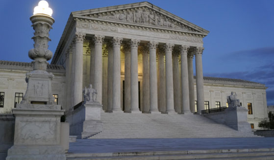 Light illuminates part of the Supreme Court building at dusk on Capitol Hill in Washington, D.C., on Nov. 16.