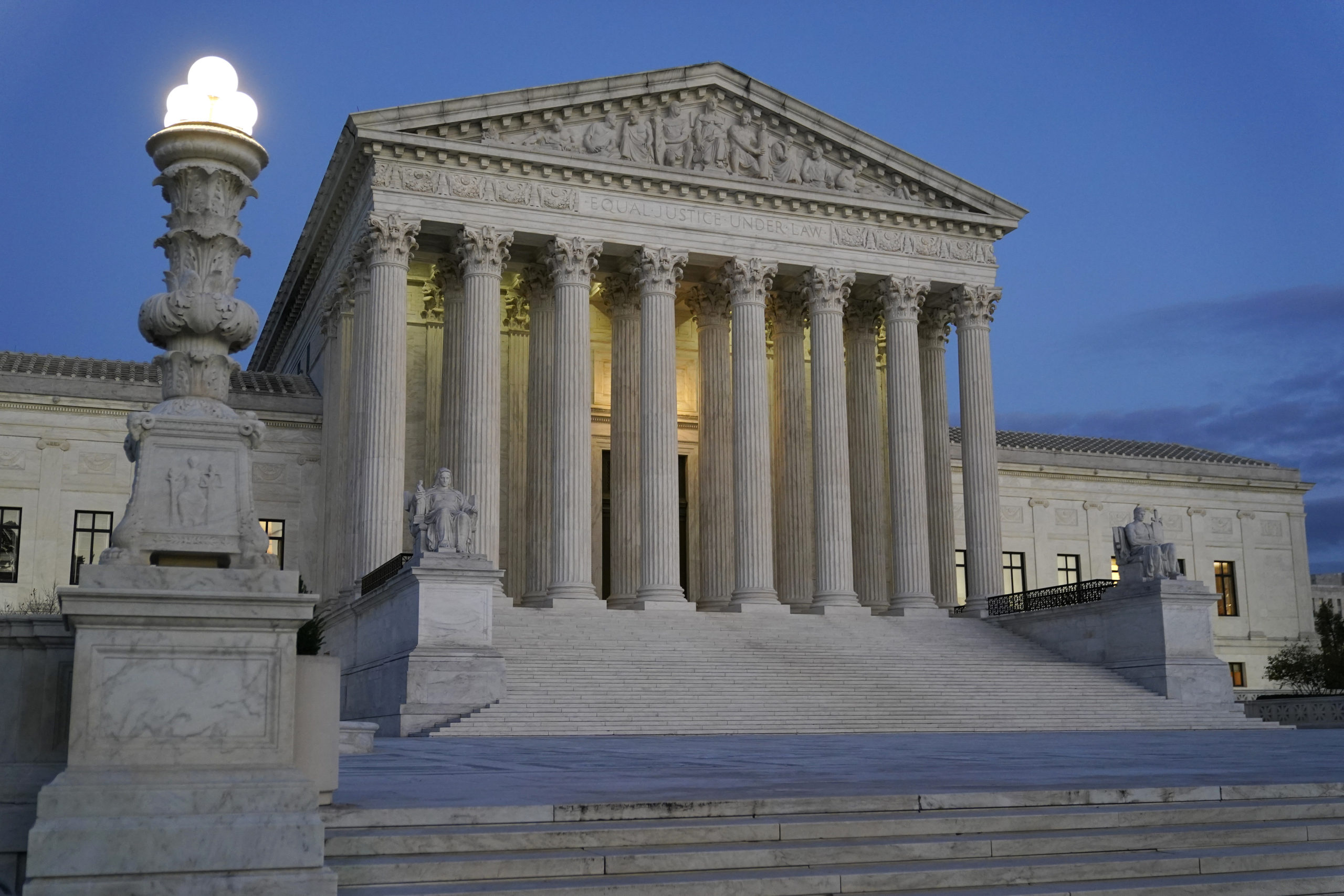 Light illuminates part of the Supreme Court building at dusk on Capitol Hill in Washington, D.C., on Nov. 16.