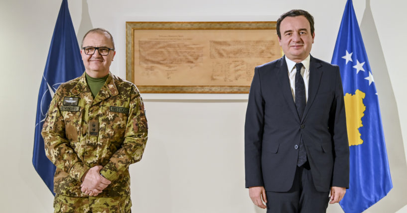 Kosovo's Prime Minister Albin Kurti, right, poses with the top NATO commander in Kosovo, Maj. Gen. Angelo Michele Ristuccia, left, in the capital Pristina, Kosovo, on Monday.