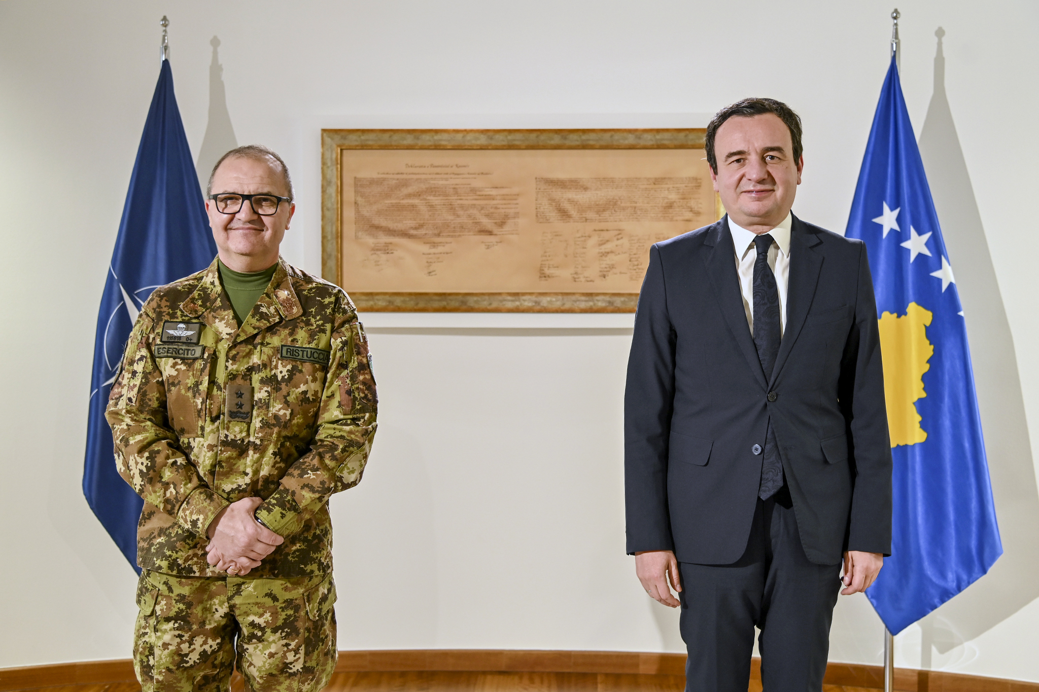 Kosovo's Prime Minister Albin Kurti, right, poses with the top NATO commander in Kosovo, Maj. Gen. Angelo Michele Ristuccia, left, in the capital Pristina, Kosovo, on Monday.