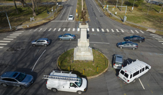 Traffic drives in the circle at the monument of confederate General A.P. Hill, which contains his remains, is in the middle of a traffic circle on Arthur Ashe Blvd. on Jan. 6 in Richmond, Virginia.