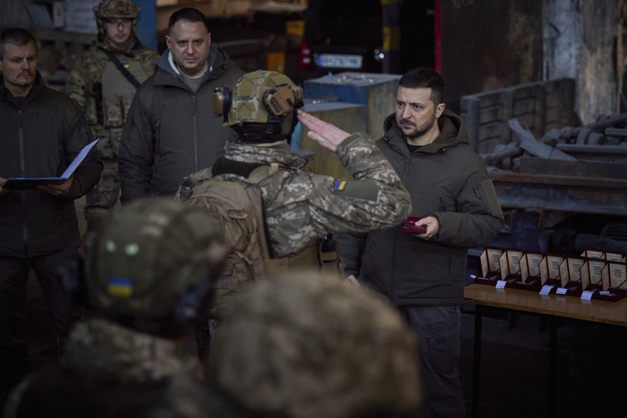 Ukrainian President Volodymyr Zelenskyy, right, awards a serviceman at the site of the heaviest battles with the Russian invaders in Bakhmut, Ukraine, on Tuesday.