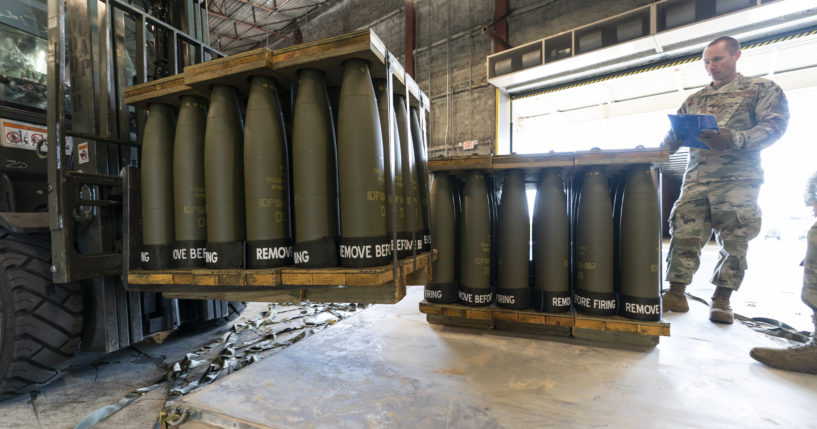 U.S. Air Force Staff Sgt. Cody Brown checks pallets of 155 mm shells bound for Ukraine on Dover Air Force Base, Delaware, on April 29, 2022.