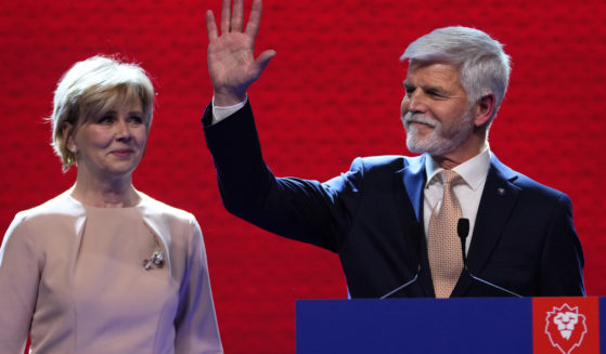 Czech Republic President-elect Petr Pavel, with his wife, Eva, greets supporters in Prague on Saturday after the announcement of the results in the presidential runoff.