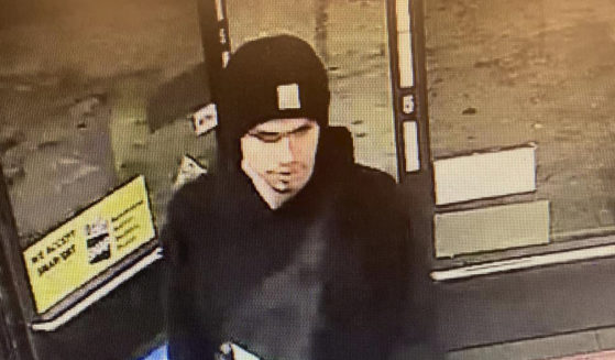 A suspect sought in a shooting at a convenience store in Yakima, Washington, is seen on surveillance footage early on Tuesday.