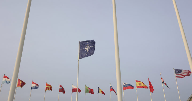 Flags of NATO members fly outside the NATO headquarters ahead of NATO Secretary General Jens Stoltenberg, European Commission President Ursula von der Leyen and European Council President Charles Michel signing a joint declaration on NATO-EU Cooperation at NATO headquarters in Brussels, Belgium, on Tuesday.