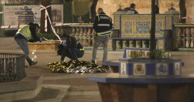 Police in Algeciras, Spain, work next to the body of a man who was killed during an attack on a local church on Wednesday.