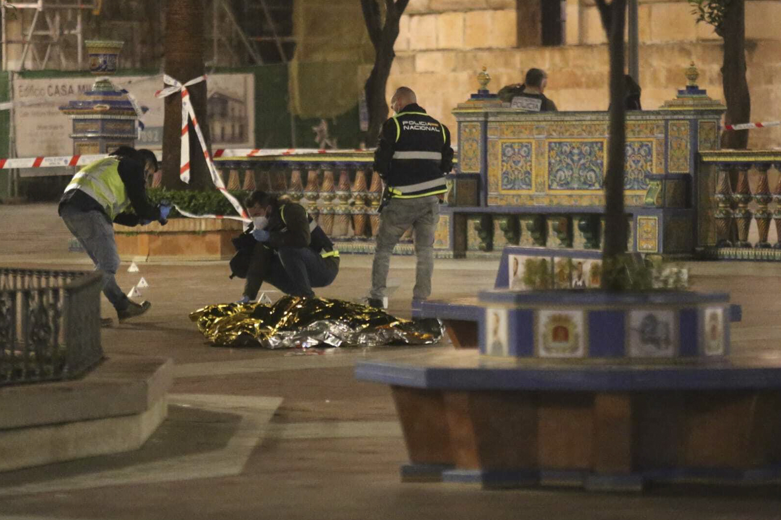 Police in Algeciras, Spain, work next to the body of a man who was killed during an attack on a local church on Wednesday.