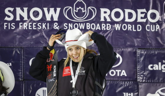 Eileen Gu of China celebrates on the podium after her victory in the women's World Cup freestyle ski halfpipe event in Calgary, Alberta, on Jan. 21.