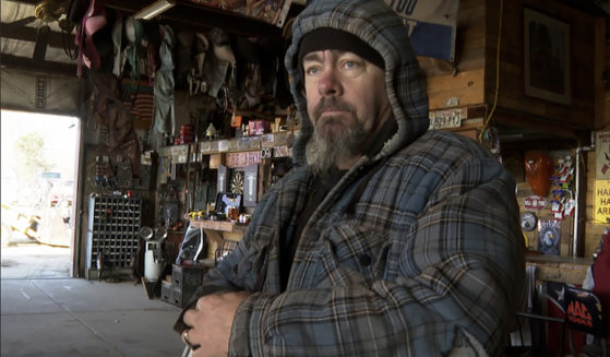 David Hollon stands inside his garage in Autauga County, Alabama on Saturday.