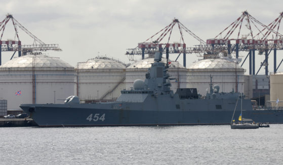 People on a yacht, right, protest against the Russian frigate Admiral Gorshkov docked in the Cape Town Harbour, South Africa, on Tuesday en route to the South African east coast to conduct naval exercises with South Africa and China.