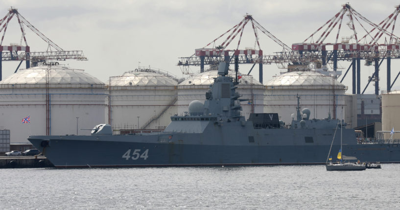 People on a yacht, right, protest against the Russian frigate Admiral Gorshkov docked in the Cape Town Harbour, South Africa, on Tuesday en route to the South African east coast to conduct naval exercises with South Africa and China.