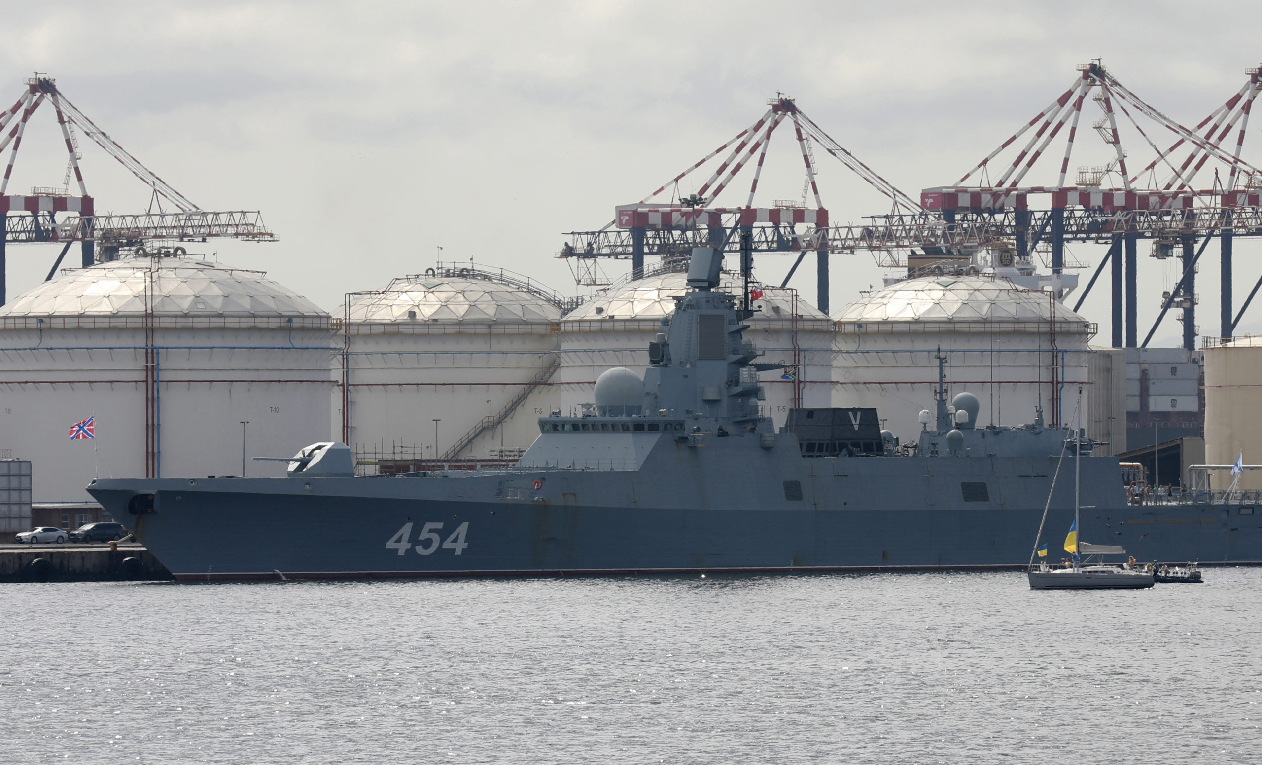 People on a yacht, right, protest against the Russian frigate Admiral Gorshkov docked in the Cape Town Harbour, South Africa, on Tuesday en route to the South African east coast to conduct naval exercises with South Africa and China.