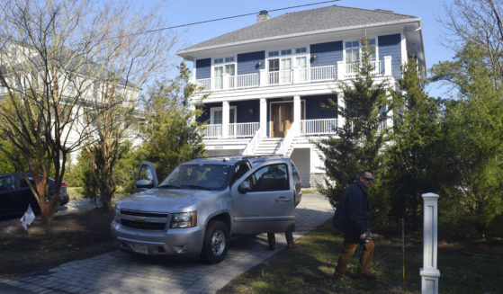 U.S. Secret Service agents are pictured in front of President Joe Biden's Rehoboth Beach, Delaware, home on Jan. 12.