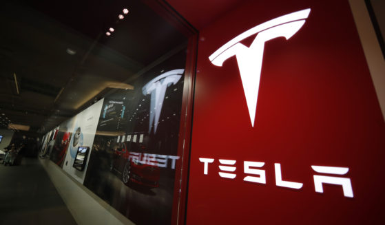 A sign bearing the company logo outside a Tesla store in Cherry Creek Mall in Denver, Colorado is pictured on Feb. 9, 2019.