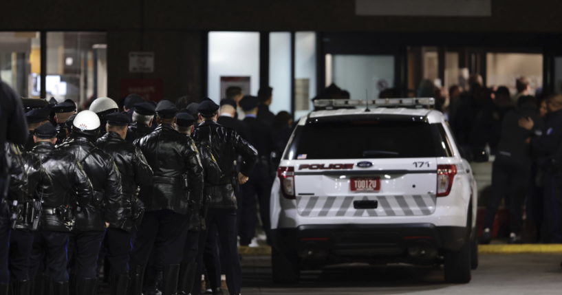 Police gather at Temple University Hospital following a fatal shooting of a Temple University police officer near the campus in Philadelphia on Saturday.