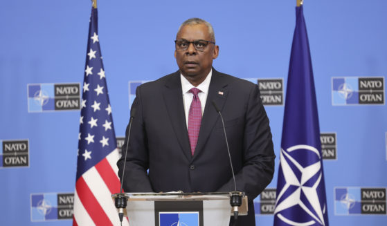 U.S. Secretary of Defense Lloyd Austin reads a statement following a NATO defense ministers meeting at NATO headquarters in Brussels, Wednesday.