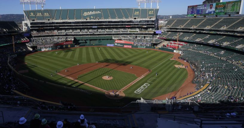 Spectators watch a baseball game between the Oakland Athletics and the Texas Rangers at the Oakland Coliseum in Oakland, California, on July 23, 2022.