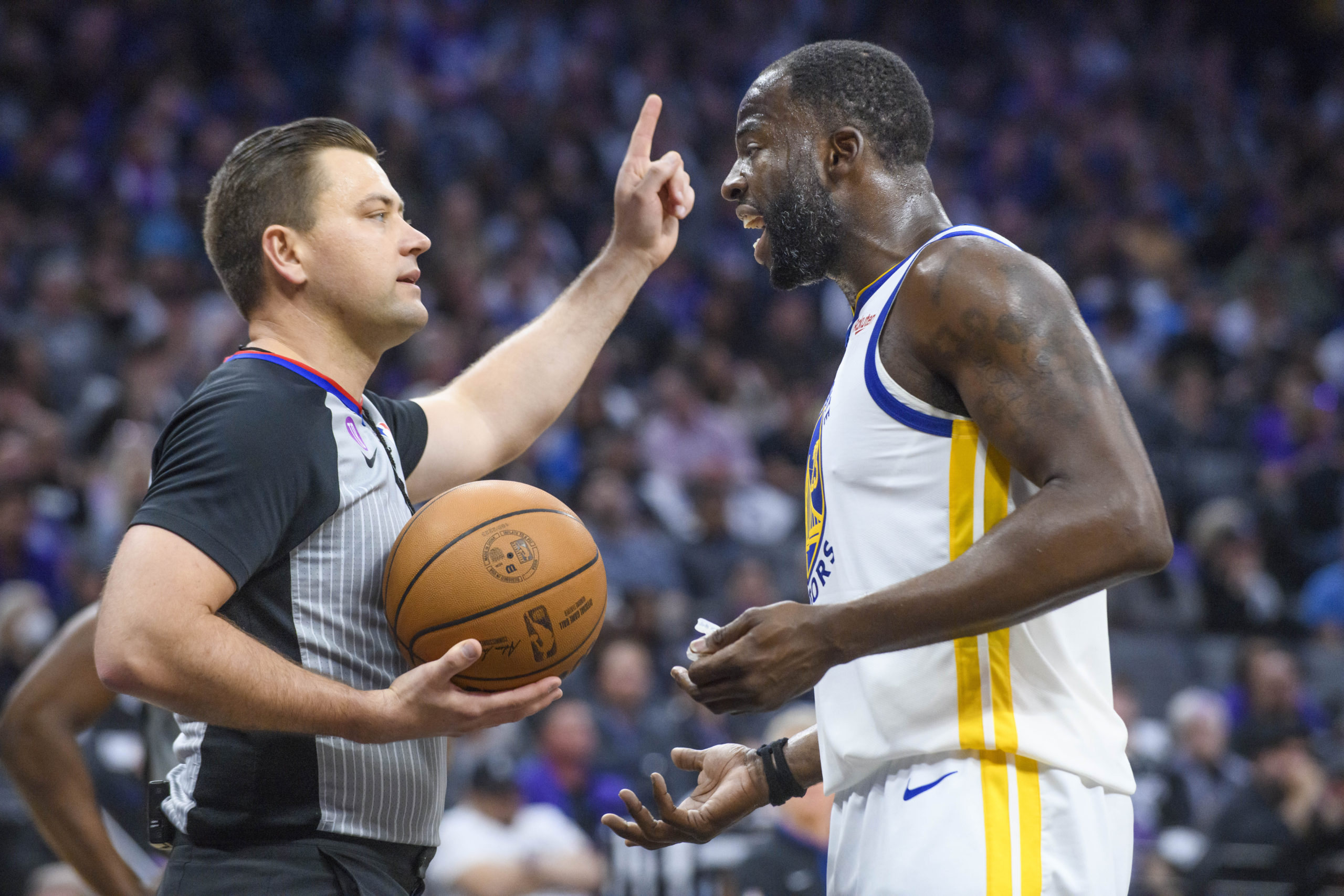 Golden State Warrior forward Draymond Green, right, argues with referee Gediminas Petraitis during the first half of game 2 of the NBA playoffs against the Sacramento Kings in Sacramento, California, on Monday.