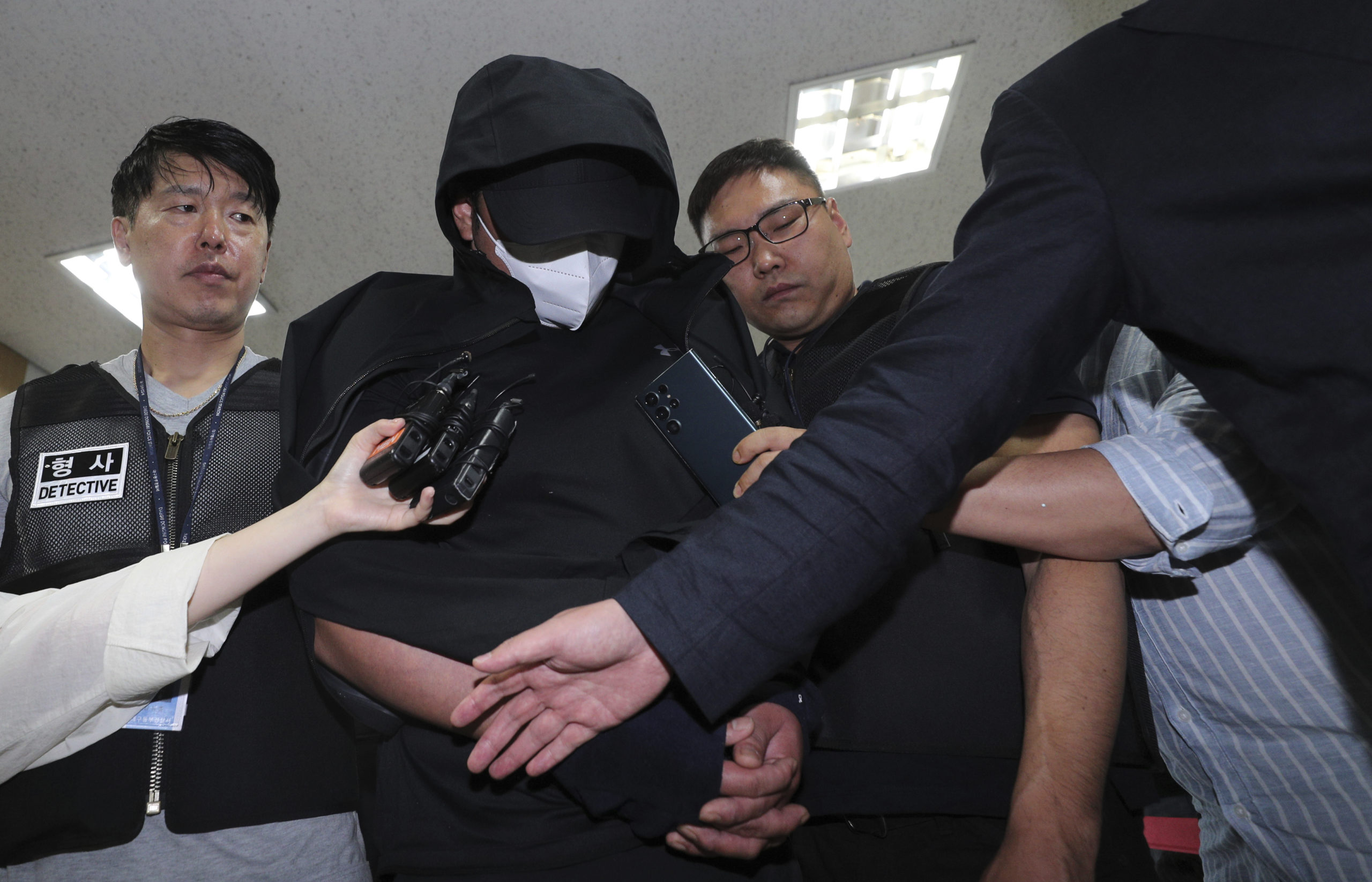 A man who opened an emergency exit door during a flight, arrives to attend an arrest warrant review at the Daegu District Court in Daegu, South Korea, on Sunday.