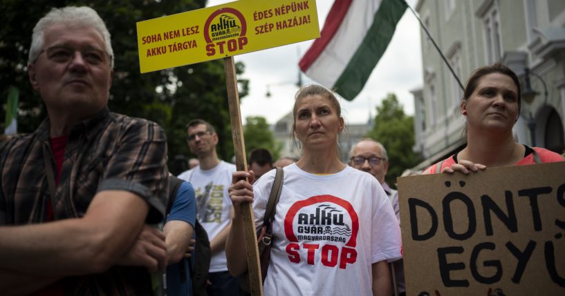 Residents gather in Debrecen, Hungary, during a demonstration against a factory that will produce batteries for electric vehicles built by a China-based company on Tuesday, May 23, 2023. (Denes Erdos / Associated Press)