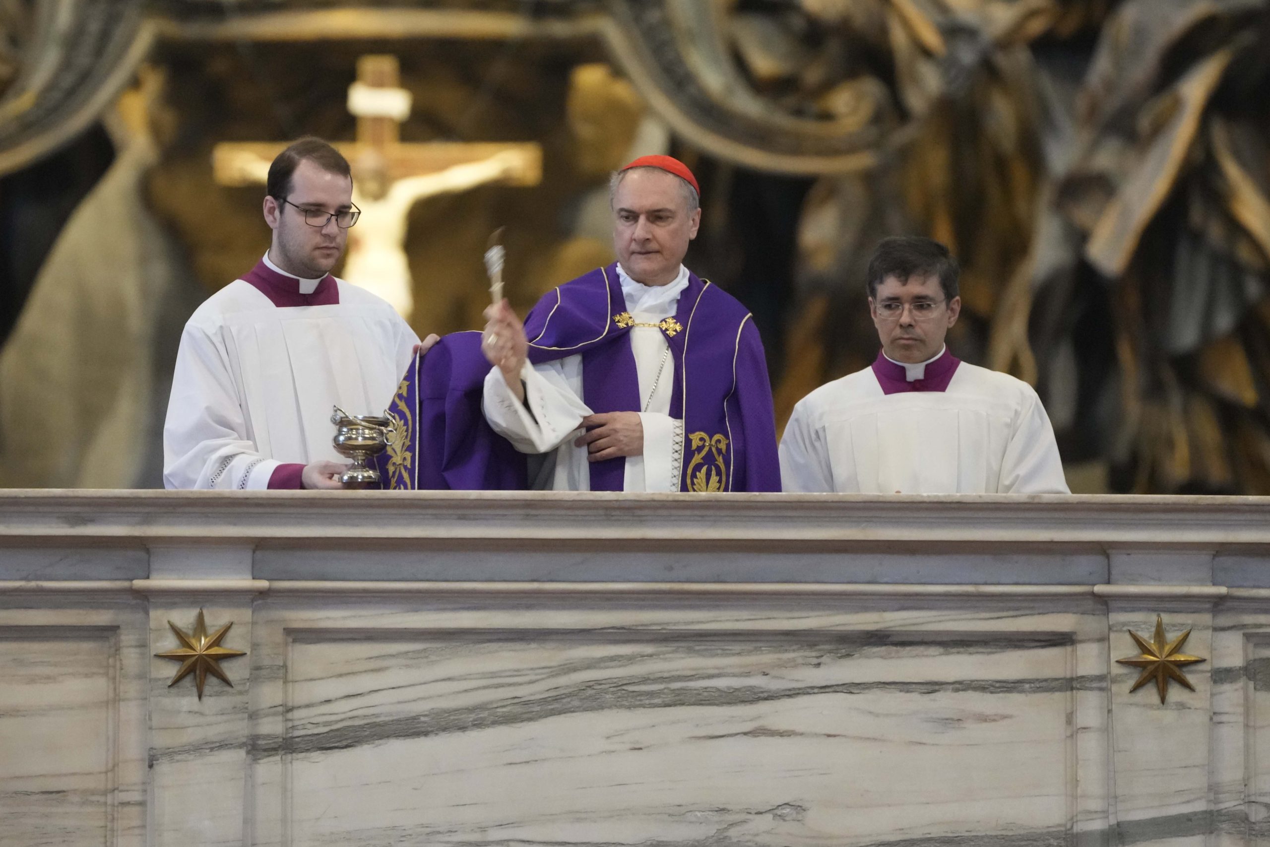 Cardinal Mauro Bassetti, center, blesses the altar of the confession during a penitential rite inside St. Peter's Basilica Saturday.