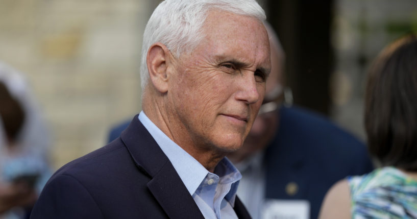 Former Vice President Mike Pence talks with local residents during a meet and greet May 23 in Des Moines, Iowa. Pence will officially launch his widely expected campaign for the Republican nomination for president in Iowa on June 7.